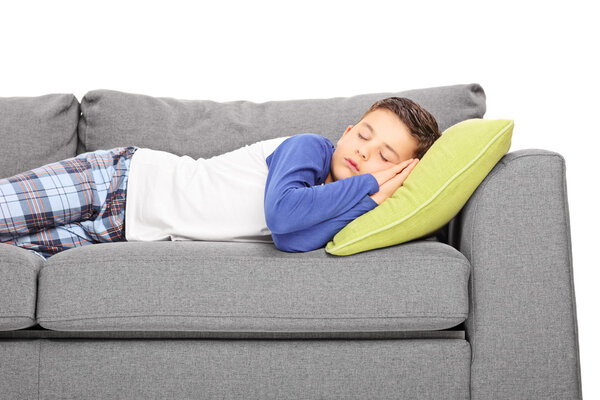 Little boy sleeping on couch 