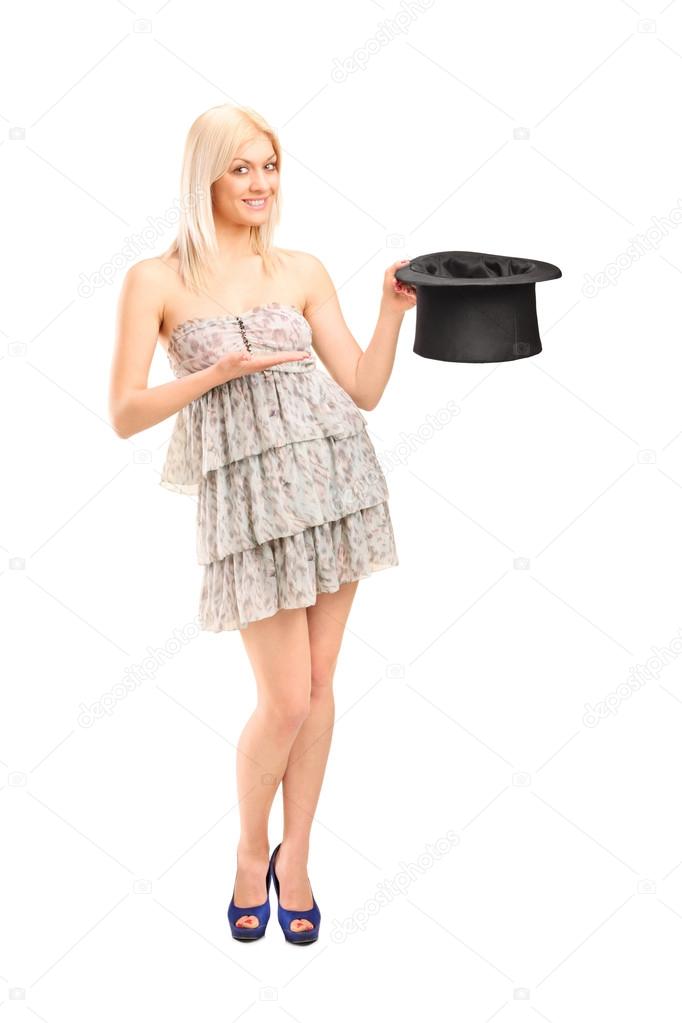 Blond woman holding top hat