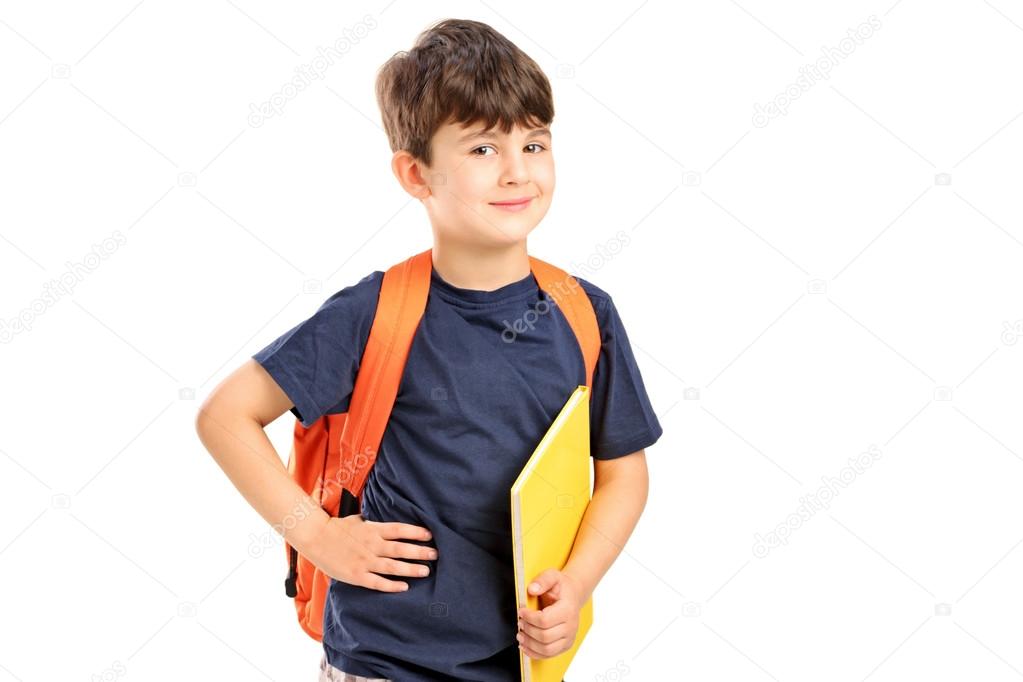 School boy holding notebook