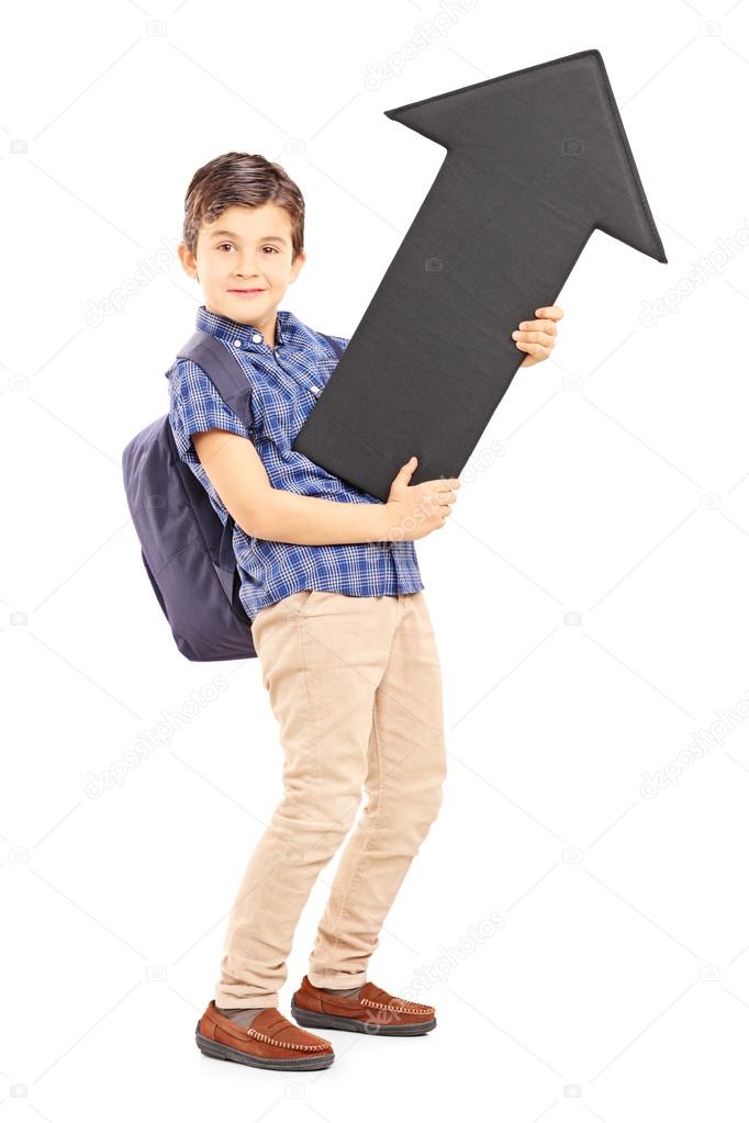 Schoolboy holding black arrow