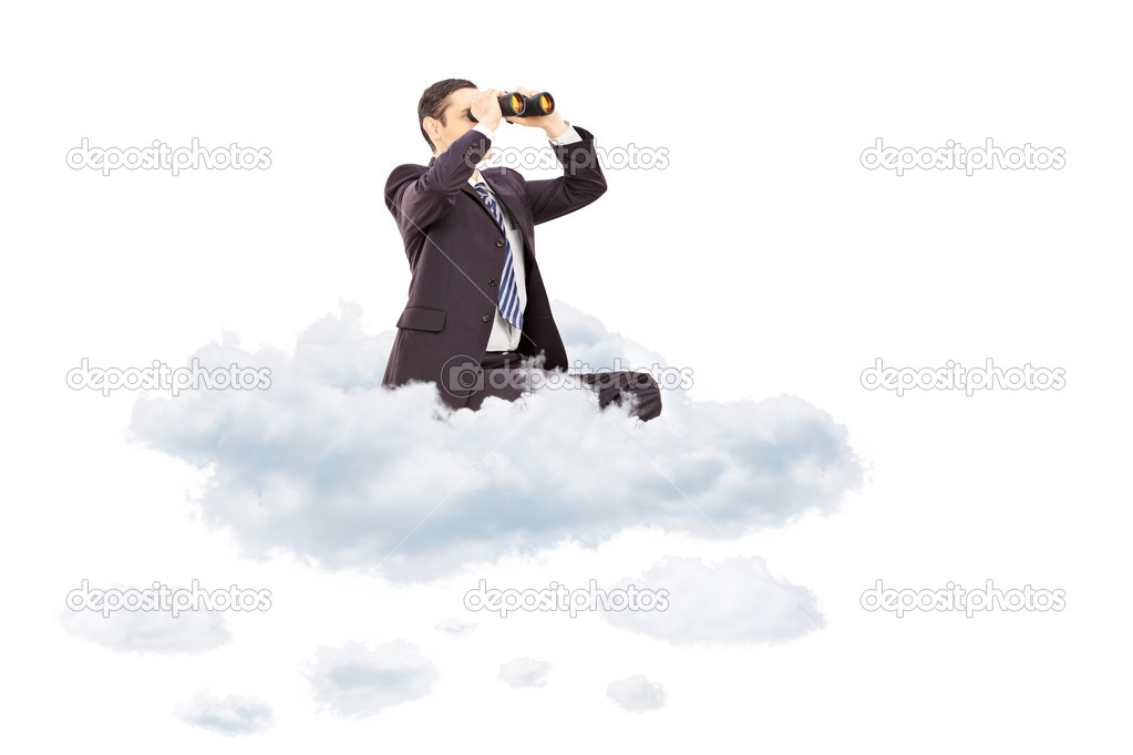 Businessman looking through binoculars