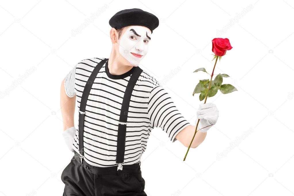 Mime artist giving rose flower
