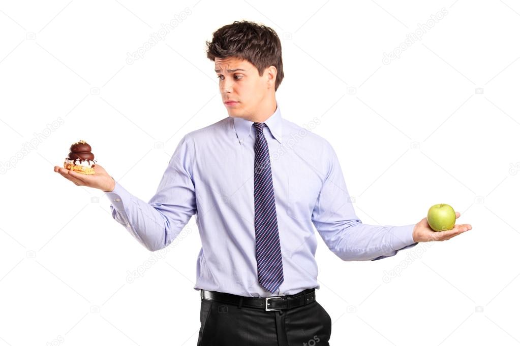 Man holding apple and cake