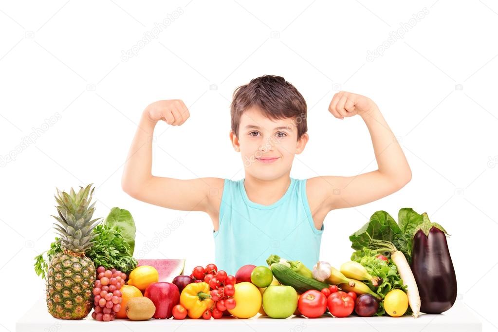 Child showing his muscles