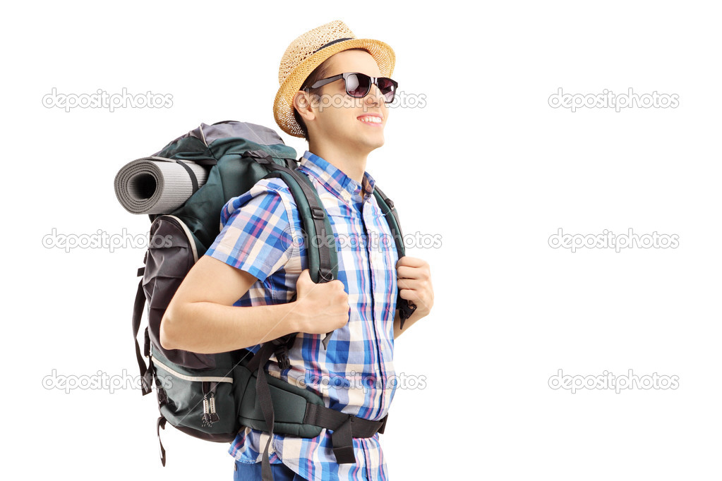 Male tourist with backpack walking 