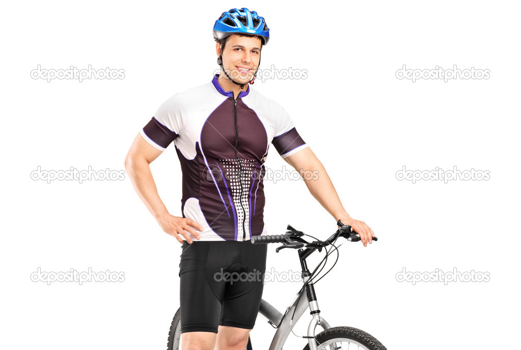 Bicyclist posing next to bicycle