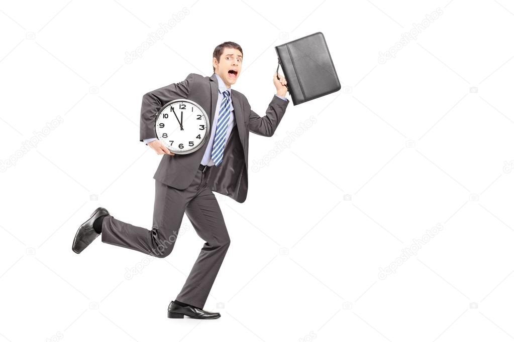 Businessperson running late with clock