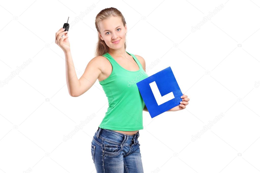 Teenager holding L and key