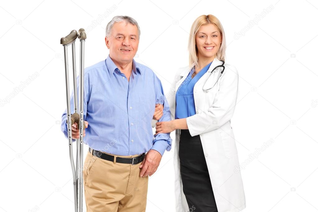 Female doctor holding senior patient