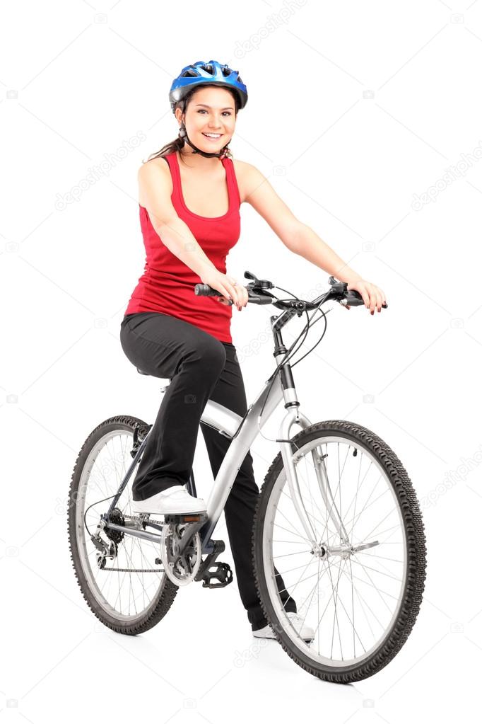 Biker with helmet next to bike