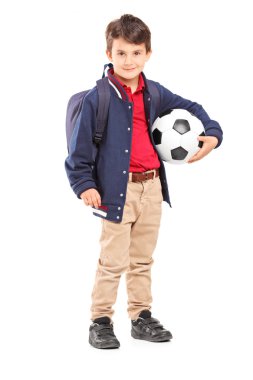 Futbol topu tutan bir okul çocuğu