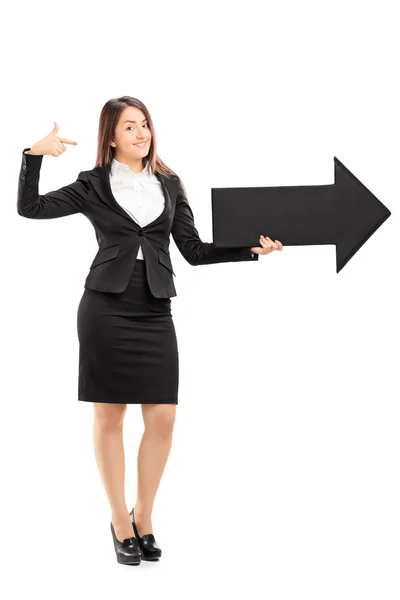 Businesswoman holding arrow — Stock Photo, Image