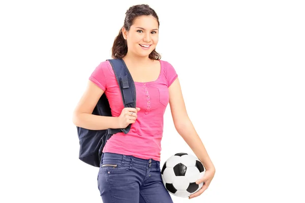 Menina segurando uma bola de futebol — Fotografia de Stock