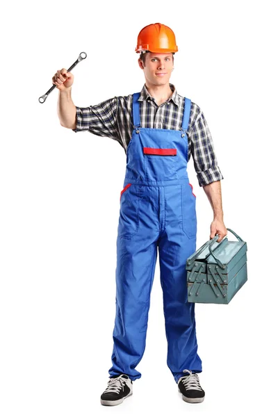 Reparador sosteniendo caja de herramientas y llave inglesa —  Fotos de Stock