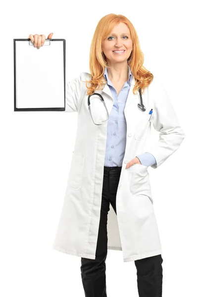 Female doctor holding clipboard — Stock Photo, Image