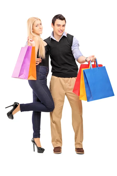 Erkek ve dişi holding alışveriş torbaları — Stok fotoğraf