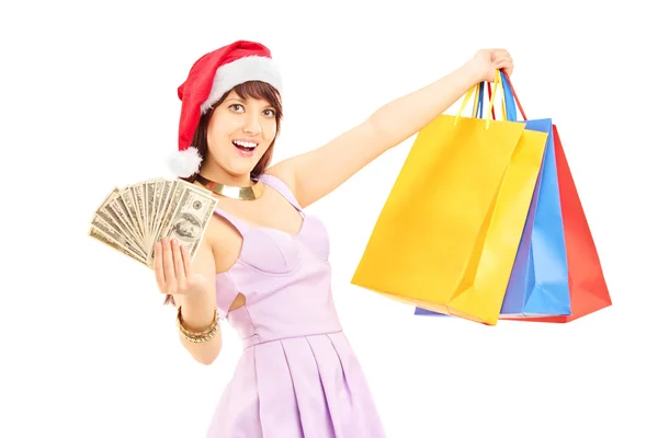 Female with shopping bags and dollars — Stock Photo, Image