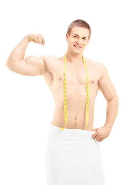 Muscular man showing his biceps — Stock Photo, Image