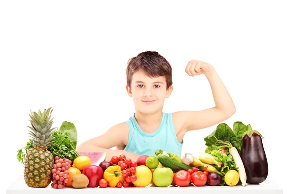 Healthy child showing muscles — Stock Photo, Image