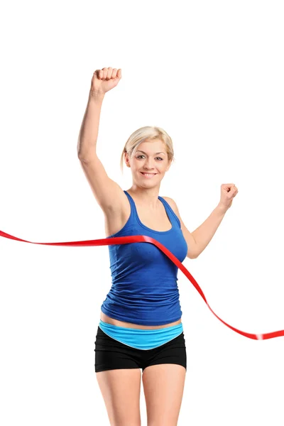 Female running towards finish line — Stock Photo, Image