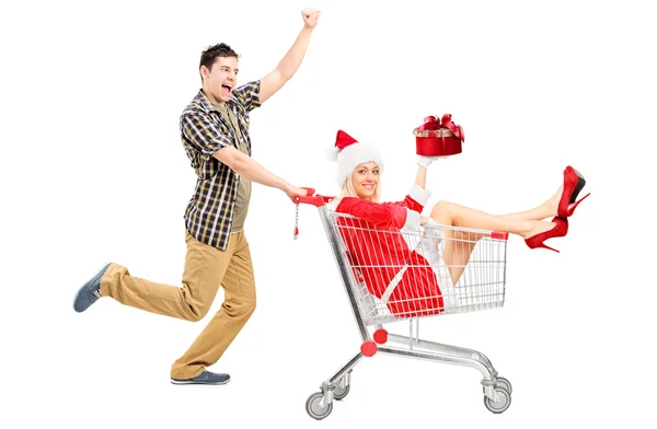 Man pushing cart and woman — Stock Photo, Image