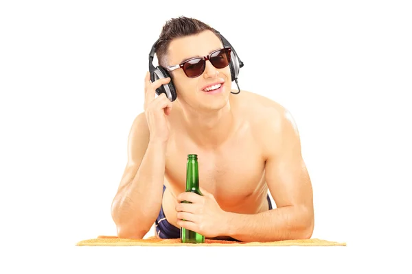 Male listening music and drinking — Stock Photo, Image