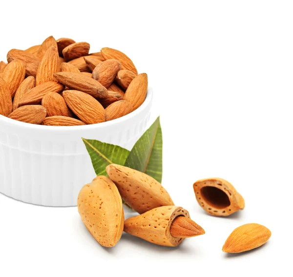 Almonds in porcelain bowl — Stock Photo, Image