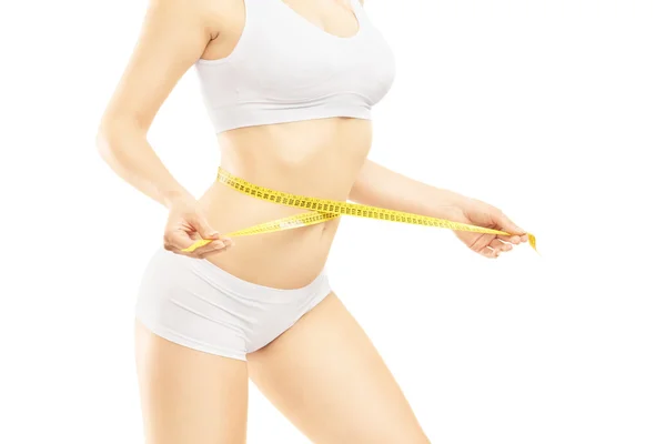 Woman measuring her waist — Stock Photo, Image