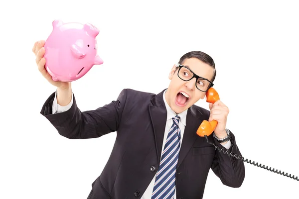 Businessman holding an empty piggybank — Stock Photo, Image