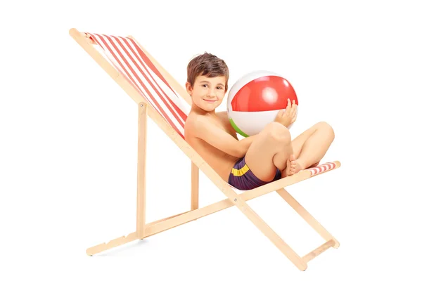 Boy on an outdoor chair — Stock Photo, Image