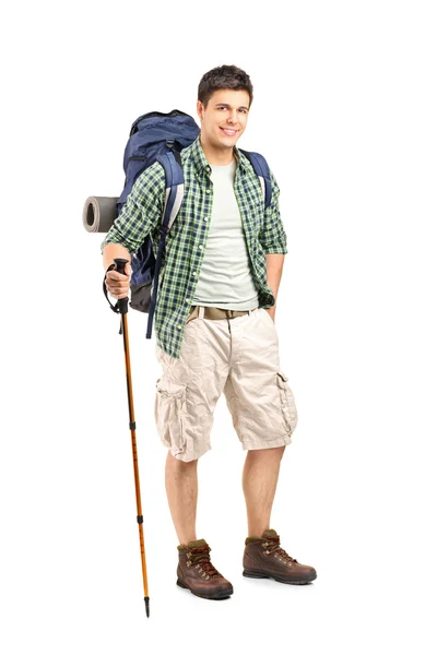 Hiker with backpack and hiking poles — Stock Photo, Image