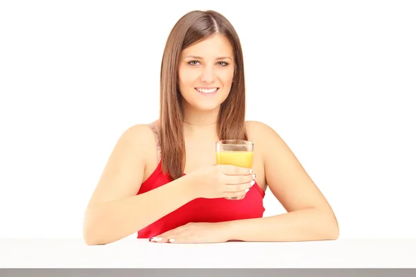Female holding juice — Stock Photo, Image