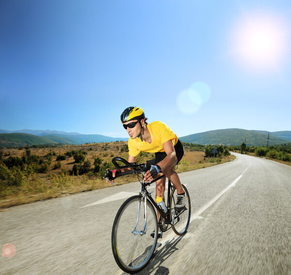 Cyclist riding bike