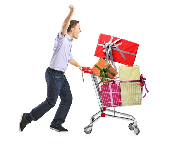 Male pushing shopping cart — Stock Photo, Image