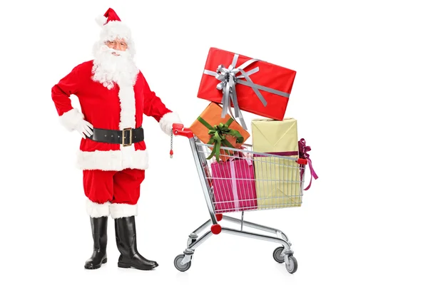 Babbo Natale spingendo carrello della spesa — Foto Stock