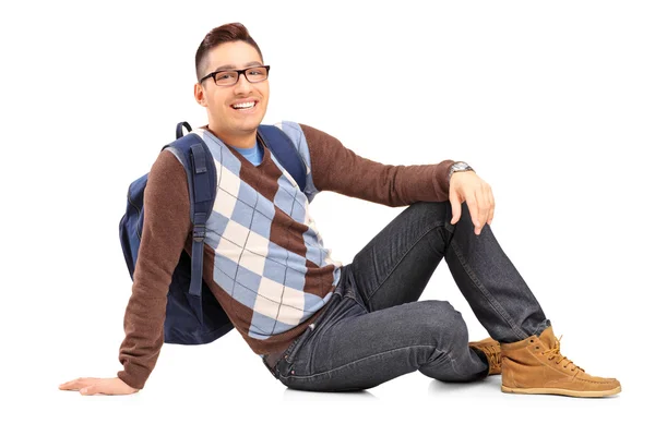 Male student sitting on the floor — Stock Photo, Image