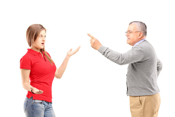 Father reprimanding teenage daughter