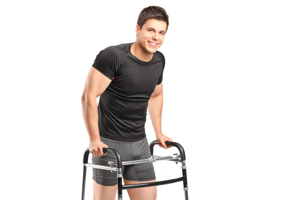 Smiling athlete using walker — Stock Photo, Image