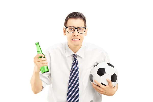 Male holding beer bottle and football — Stock Photo, Image