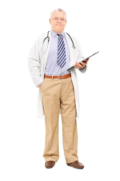 Mature doctor holding clipboard — Stock Photo, Image