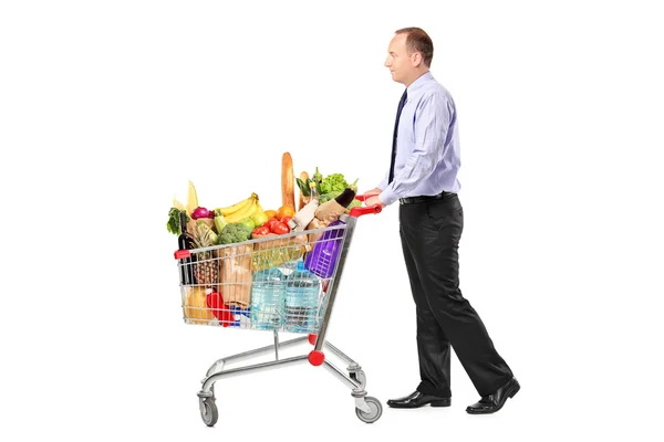 Person pushing shopping cart — Stock Photo, Image