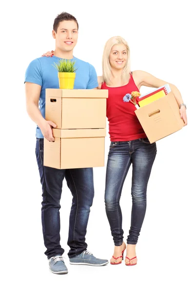 Male and female holding moving boxes — Stock Photo, Image