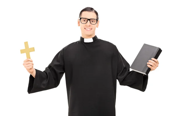 Priest holding bible and cross — Stock Photo, Image