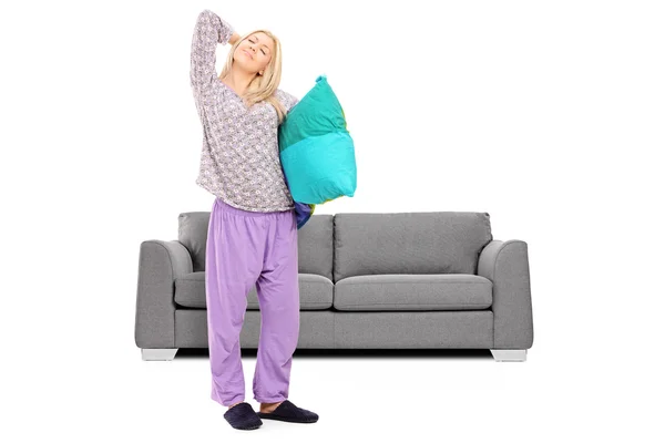 Woman in pajamas stretching — Stock Photo, Image