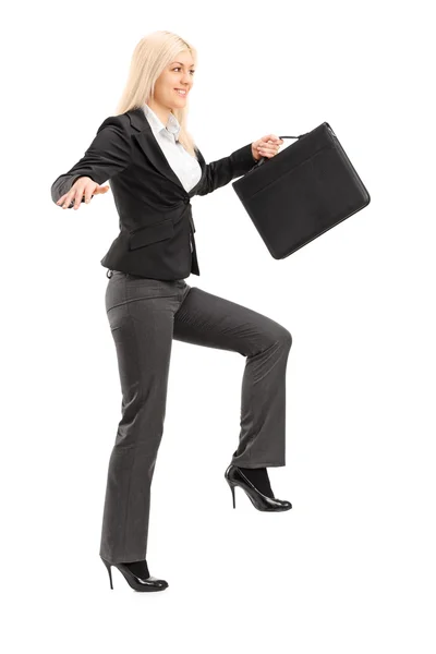 Businesswoman trying to keep balance — Stock Photo, Image