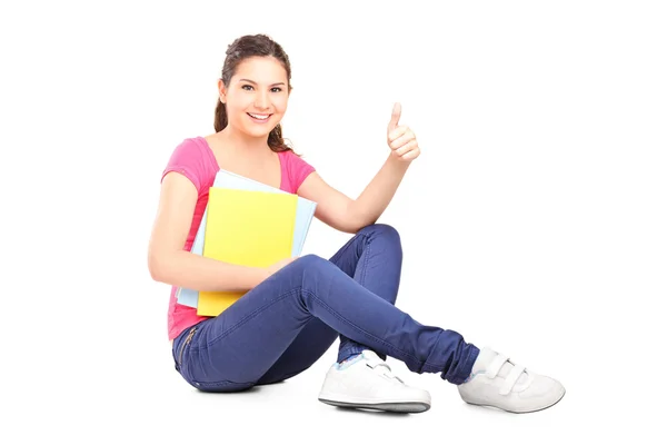 Mujer estudiante dando pulgar hacia arriba — Foto de Stock