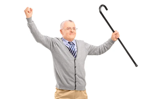 Senior man holding cane — Stock Photo, Image