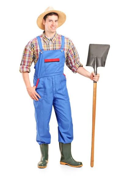 Agricultural worker holding shovel — Stock Photo, Image