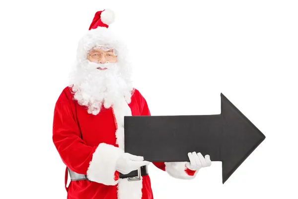Santa claus bedrijf zwarte pijl — Stockfoto