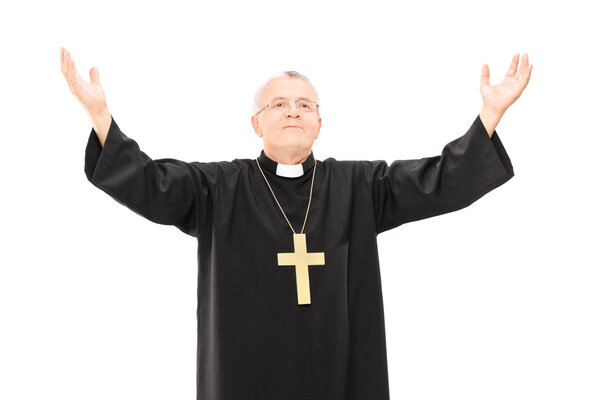 Mature priest with hands in air